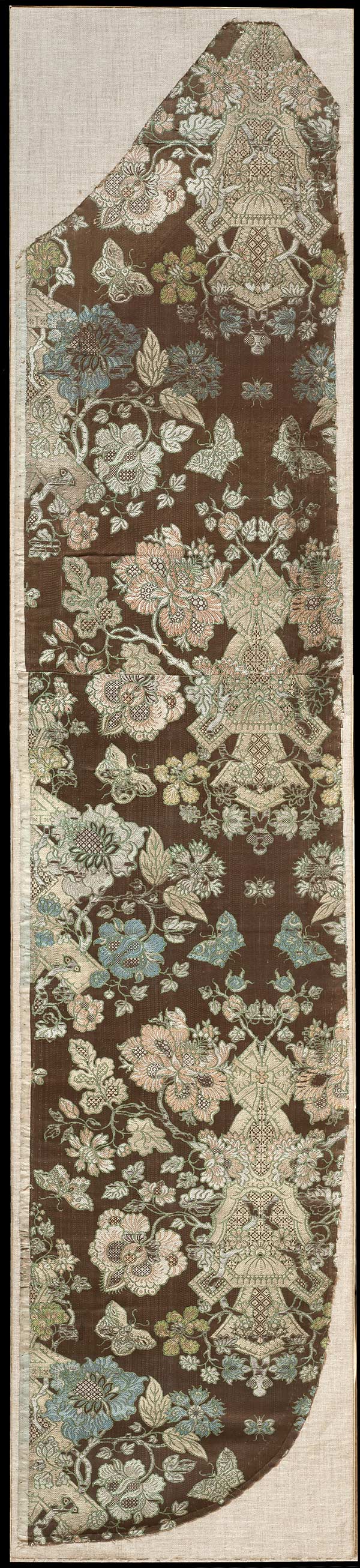 Spitalfields Silk, Joseph Dandridge, Brown satin ground brocaded with silver & gold threads patterned with flowers & butterflies, Circa 1705 - 1710, 127 x 27 cms